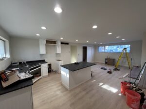Recessed lighting in a finished open-concept kitchen and living area